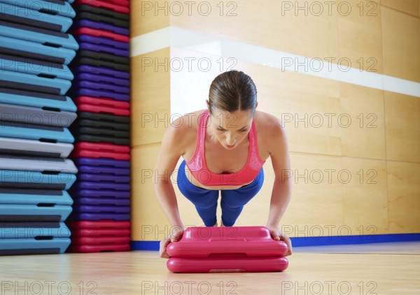 Push up push-ups woman exercise workout at gym indoor