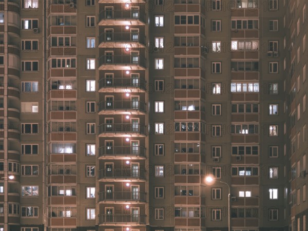 Night view of exterior apartment building. High rise apartments in night light