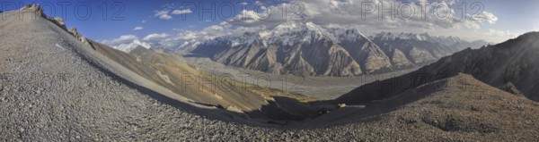 Scenic panorama of valley and mountain peaks in Tien-Shan mountain range in Kyrgyzstan