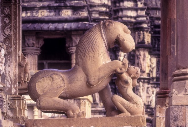 Sculptures of a mythical lion and woman at the Kandariya Mahadeva in Khajuraho, Madhya Pradesh, India, Asia. World heritage site, Asia