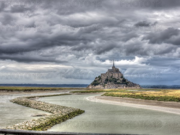 View along the Couesnon towards Mont Saint-Michel from Point de vue du Mont-Saint-Michel, with the mood of sombre clouds, Mont Saint-Michel, UNESCO World Heritage Site, Normandy, France, Europe