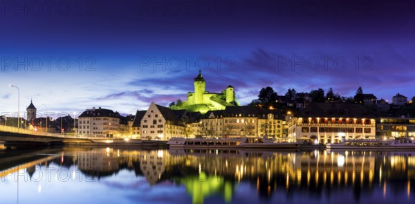 A horizontal river view and panorama cityscape of Schaffhausen with the Rhine River and Munot at sunset