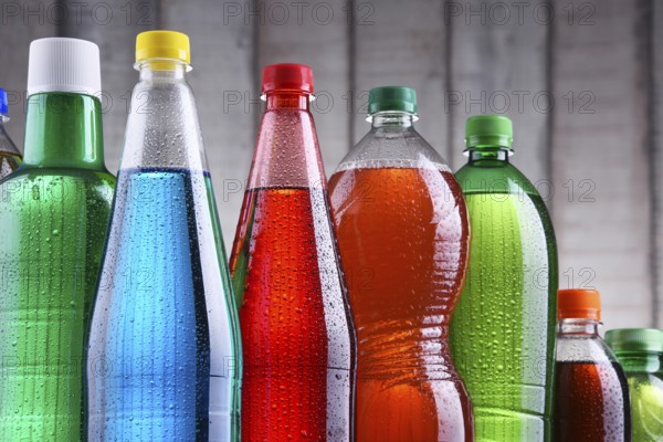 Plastic bottles of assorted carbonated soft drinks in variety of colors