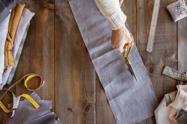 Person cutting fabric sewing