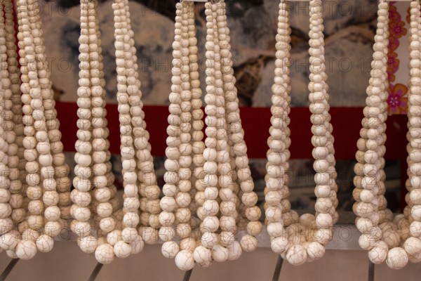 Handcrafted necklace. String of beads in various colors. Colorful beads necklaces