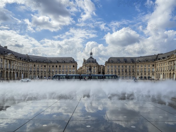 BORDEAUX/FRANCE - SEPTEMBER 19 : Miroir d'Eau at Place de la Bourse in Bordeaux France on September 19, 2016. Unidentified people