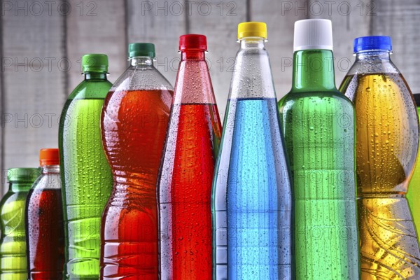 Plastic bottles of assorted carbonated soft drinks in variety of colors