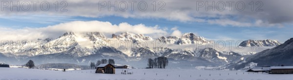 Snowy mountains, meadow and a hut, landscape in Austria, panorama