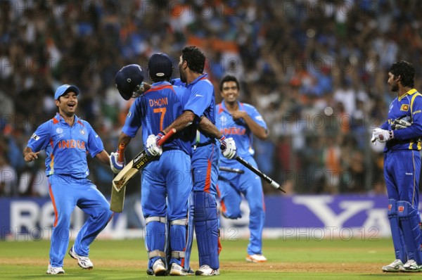 Mahendra Singh Dhoni 2R team mate Yuvraj Singh R Piyush Chawla R Ashwin L celebrate ICC Cricket World Cup 2011 final Wankhede