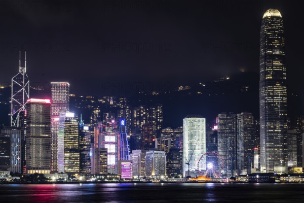 HONG KONG, CHINA - SEPTEMBER 27 2024: Night time view of Hong Kong Island and Victoria Harbour from Kowloon on a autumn evening, Hong Kong, China, Asia