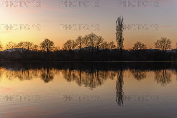 Autumn landscape of trees reflecting in the water at sunset. Autumn landscape. Bas-Rhin, Alsace, Grand Est, France, Europe