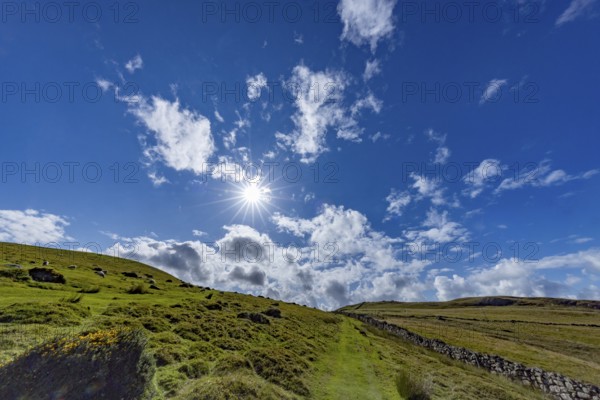 Hilly landscape with green meadows and stone wall, dry stone wall on the edge of Snowdonia National Park, Penmaenmawr, Dwygyfylchi, Caernarfonshire, Conwy County Borough, Wales, United Kingdom, Europe