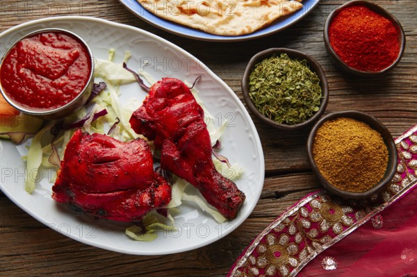 Chicken Tandoori indian recipe with spices on wood