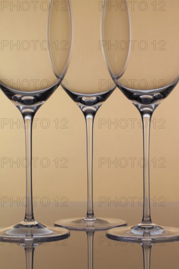 Three empty glasses of wine on a clean background