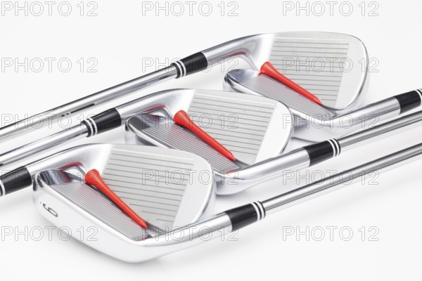 Titanium golf clubs on the white background