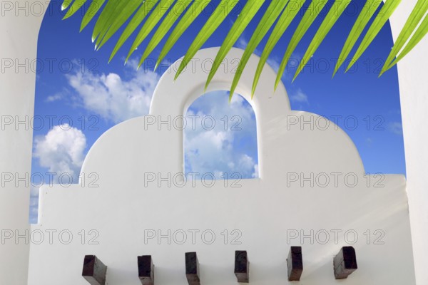 Mexican architecture white archs blue sky in Mayan Riviera