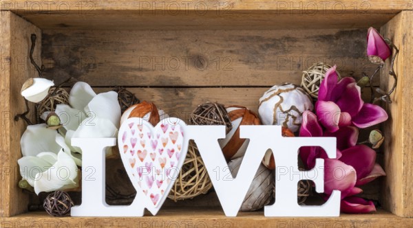 An image of a love decoration in a wooden box