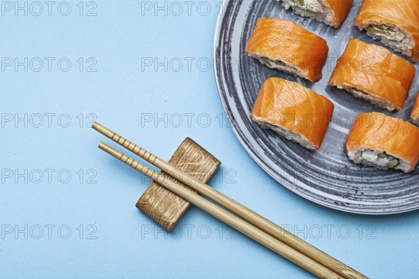 Rolls Philadelphia With Salmon Eel On Blue Background