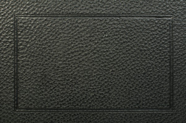 Old vintage black leather background. Studio shot