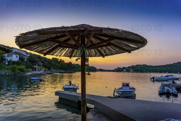 Beautiful sunset on the island of Dugi Otok in Croatia in summer. A popular holiday destination on the Mediterranean. Beautiful Sunset on the Isle of Dugi Otok in Croatia in summertime. A famous place for travel and vacation