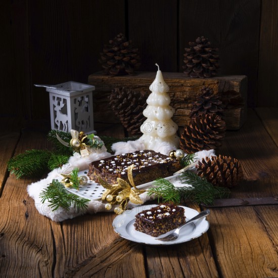 Christmas poppy seed cake with chocolate, nuts and sultanas