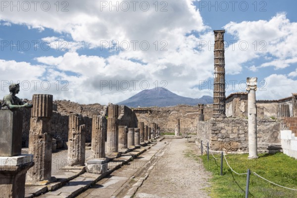 POMPEII, ITALY, MAY 04, 2022, Colonnade and sculptures of the Temple of Apollo near the Pompeian forum, Southern Italy