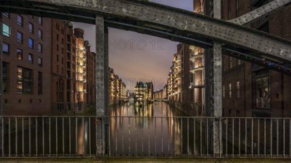 The moated castle in the Speicherstadt photographed from the Poggemühlen Bridge