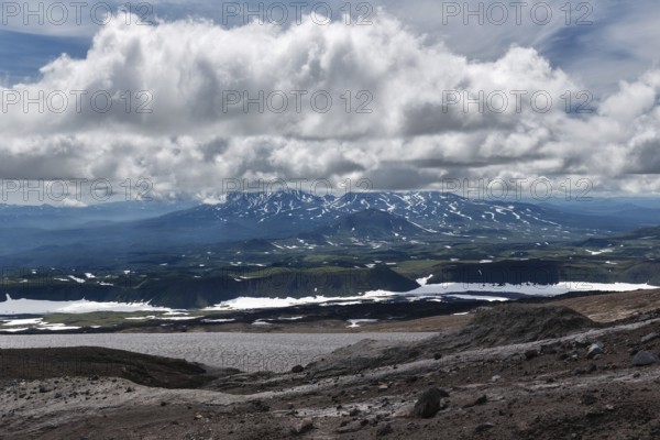 Beautiful mountain (volcanic) cloudy landscape of Kamchatka Peninsula. Asia, Russian Far East