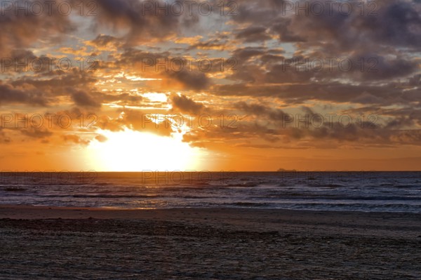 Sunset at the North Sea beach of Denmark with beautiful light on a summer day. Sunset at the North Sea beach of Denmark with beautiful light