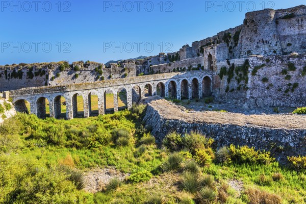 Venetian fort castle Methoni on the Greek Peninsula Peloponnese. The picturesque ancient viaduct connects the gates of the fortress with the road. The concept of active, photo and historical tourism