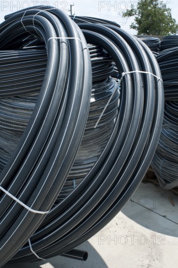 Coiled black PVC hoses. Polyethylene tubing