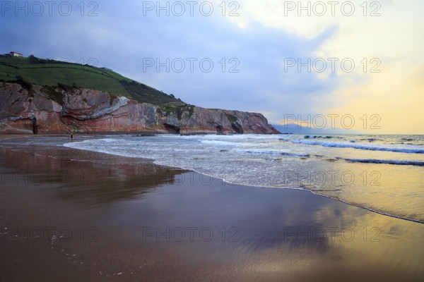 Low tide in the Atlantic. Playa Zumaya. Flysch - unique landscape of underwater rocks exposed at low tide. The Basque Country - Itsurun. Incredibly bizarre coastal cliffs
