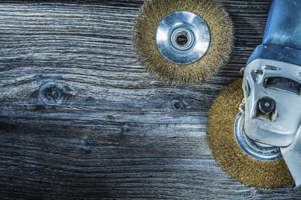 Rotary wire brushes on vintage wooden board