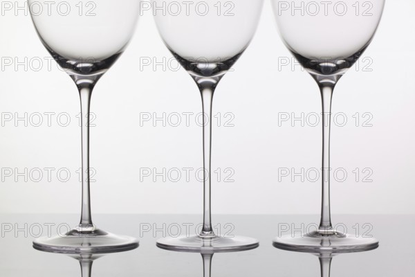 Three empty glasses of wine on a clean background