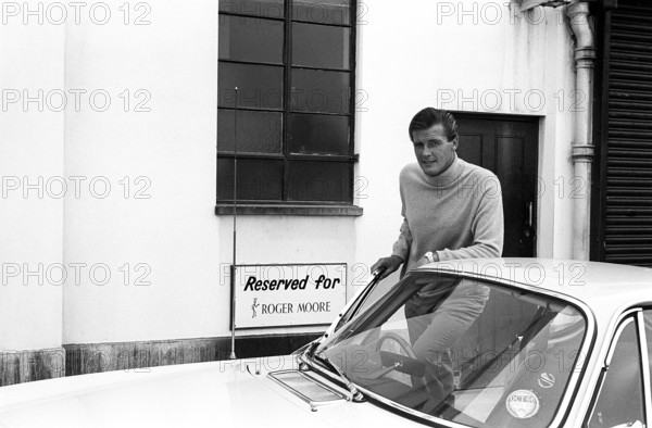 Sir Roger Moore, 1927-2017 during the filming of the tv-series The Saint, posing with a Volvo P1800 in a parking space Reserved for Roger Moore. A sports car manufactured by Volvo Cars wtih production start 1961 and ending 1973. Styling was by swedish designer Pelle Pettersson. The car was indroduced at the Geneva Motor Show in 1961. The model P1800 sold 47492 cars.The P1800 became widely known when driven by then future James Bond actor Roger Moore as Simon Templar in the television series The Saint. The Saint ran from 1962 for six seasons and 118 episodes. 1966 Sir Roger Moore, 1927-2017 during the filming of the tv-series The Saint 1966. Roger Moore is known for his role as agent James Bond, playing the character in seven feature films