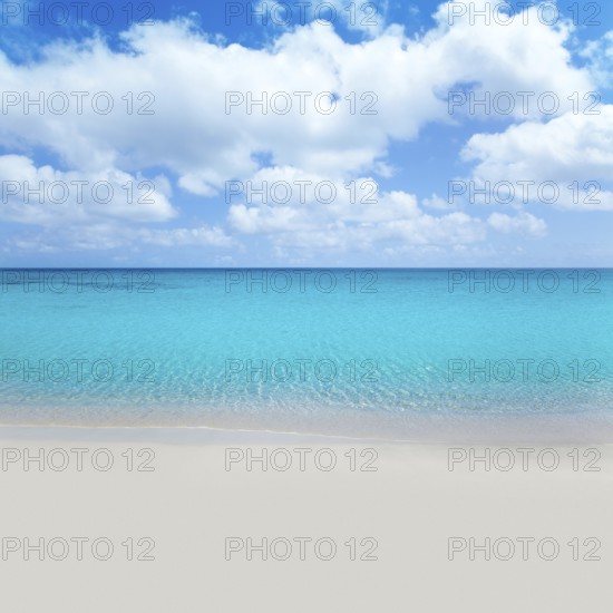 Beach tropical with white sand and turquoise water under blue sky