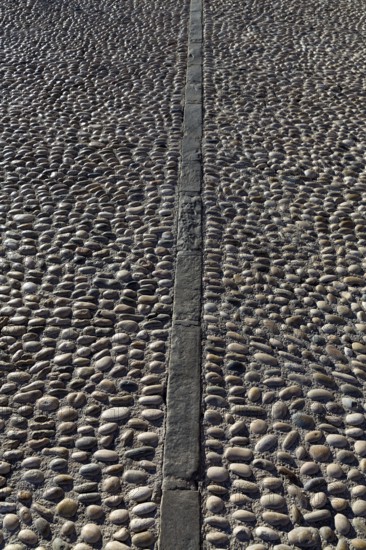 Rolling stones pavement soil texture in Altea Alicante mediterranean village of Spain