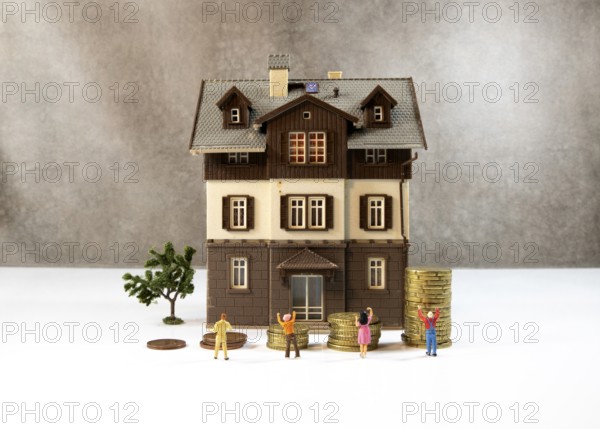 The house prices keep rising every time, this photo is a concept with coins to shop the expensive houses