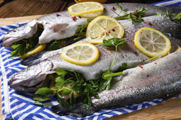 Fresh trout with lemon and various herbs