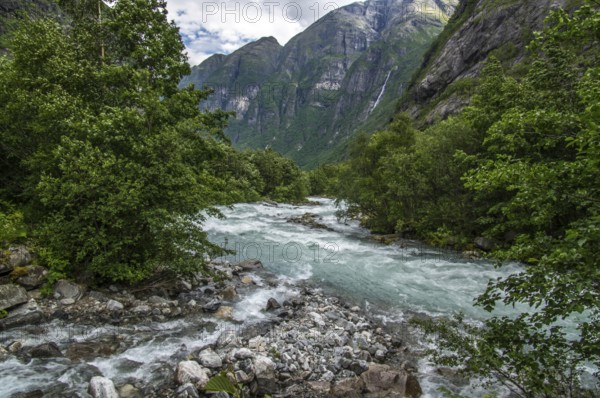 The Kjenndalsbreen is part of the Jostedalsbreen, one of the largest glaciers in Norway, and forms an impressive mountain landscape. The glacier Kjenndalsbreen in Norway is a beautiful place to travel to in summertime