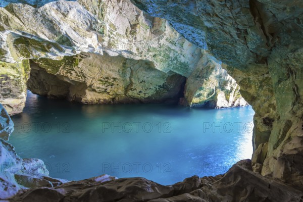 Karst cave Rosh-a-Nikra on the shores of the Mediterranean Sea. Israel. The color of sea water changes from azure to dark blue. The concept of active, environmental and photo tourism