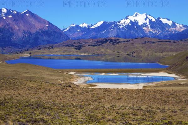 Los Glaciares is Argentina's most beautiful natural park. Pampas surround snow-capped mountains. Huge lake with azure water and arid steppe of Patagonia