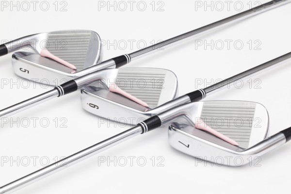 Titanium golf clubs on the white background