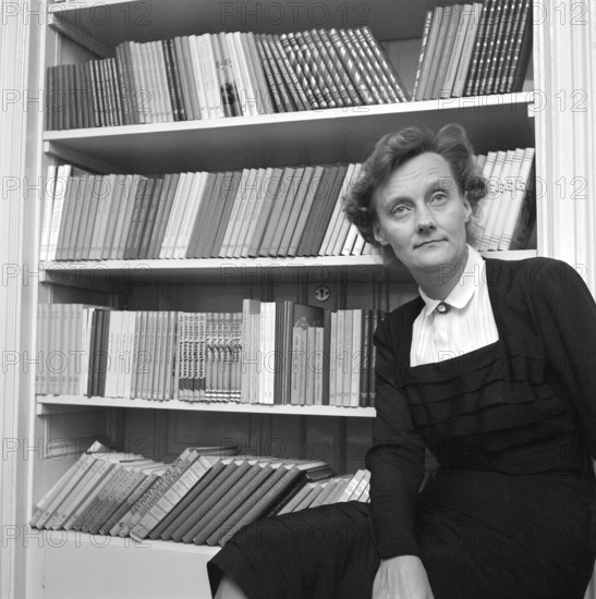Astrid Lindgren. Swedish author of childrens books, songs and novels. Born 14 november 1907 - 28 january 2002. Internationally famous for the books featurings Pippi Longstocking, Emil of Lönneberga, Karlsson-on-the-roof and the Six Bullerby children. 2017 she was calculated to be the world's 18th most translated author. Roughly 167 million of her books was sold worldwide 2010. Pictured at home in her apartment on Dalagatan 46, 16 october 1953. Conard ref 2556