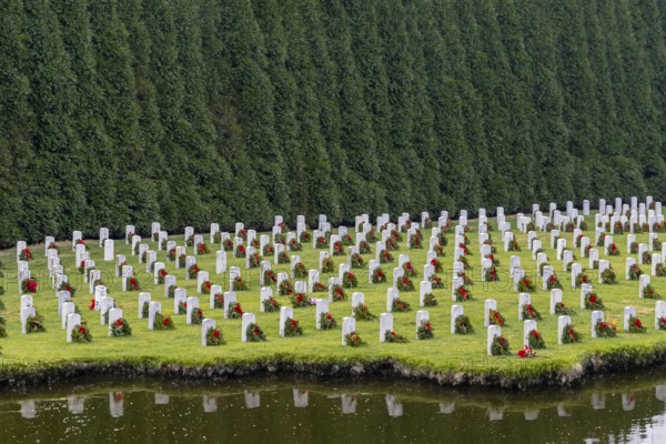 Atop a hill, a veterans cemetery with white headstones and the American flag evokes deep honour, sacrifice, and enduring national pride, Salisbury, United States of America