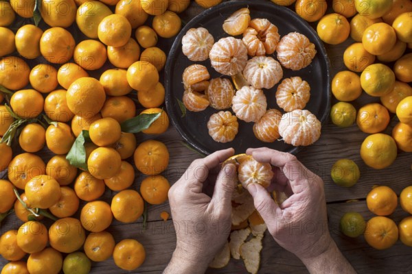 Presentation of Small peeled mandarin oranges on old wooden table