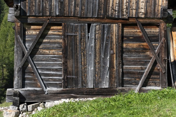 An old wooden hay shed in Val di Morins, the Dolomite Alps of South Tirol