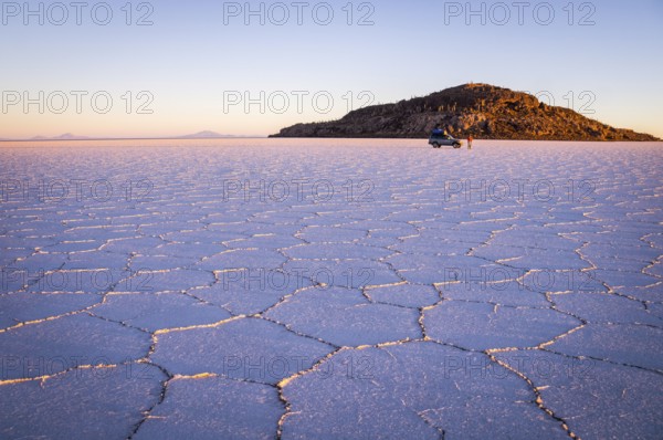 Salar Uyuni, BOLIVIA in September 2015: The sun rises over worlds largest salt lake Salar de Uyuni. Southwestern Bolivia is well-known for dramatic landscapes, lagunas, geysers and deserts