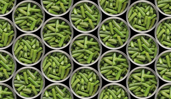 Seamless food background of flat lay view at opened tin cans with green beans isolated on black background. Clipping path added
