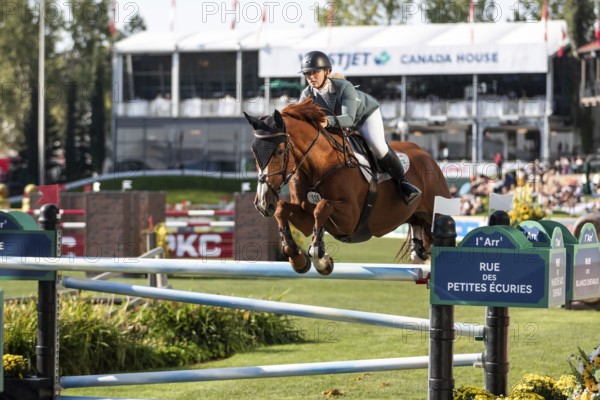 Jaydan Stettner of Canada and riding Ielinea JTL competes in the 1.45m Enbridge Cup at the Spruce Meadows, Masters in Calgary, Alberta, Canada, North America